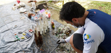 person sampling beach litter